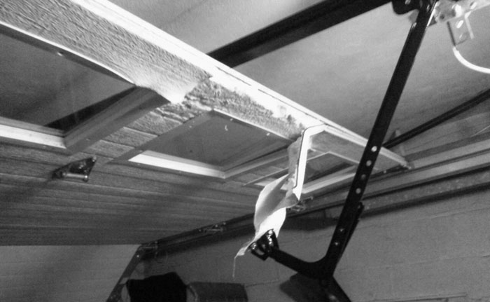 Broken overhead garage door repairer